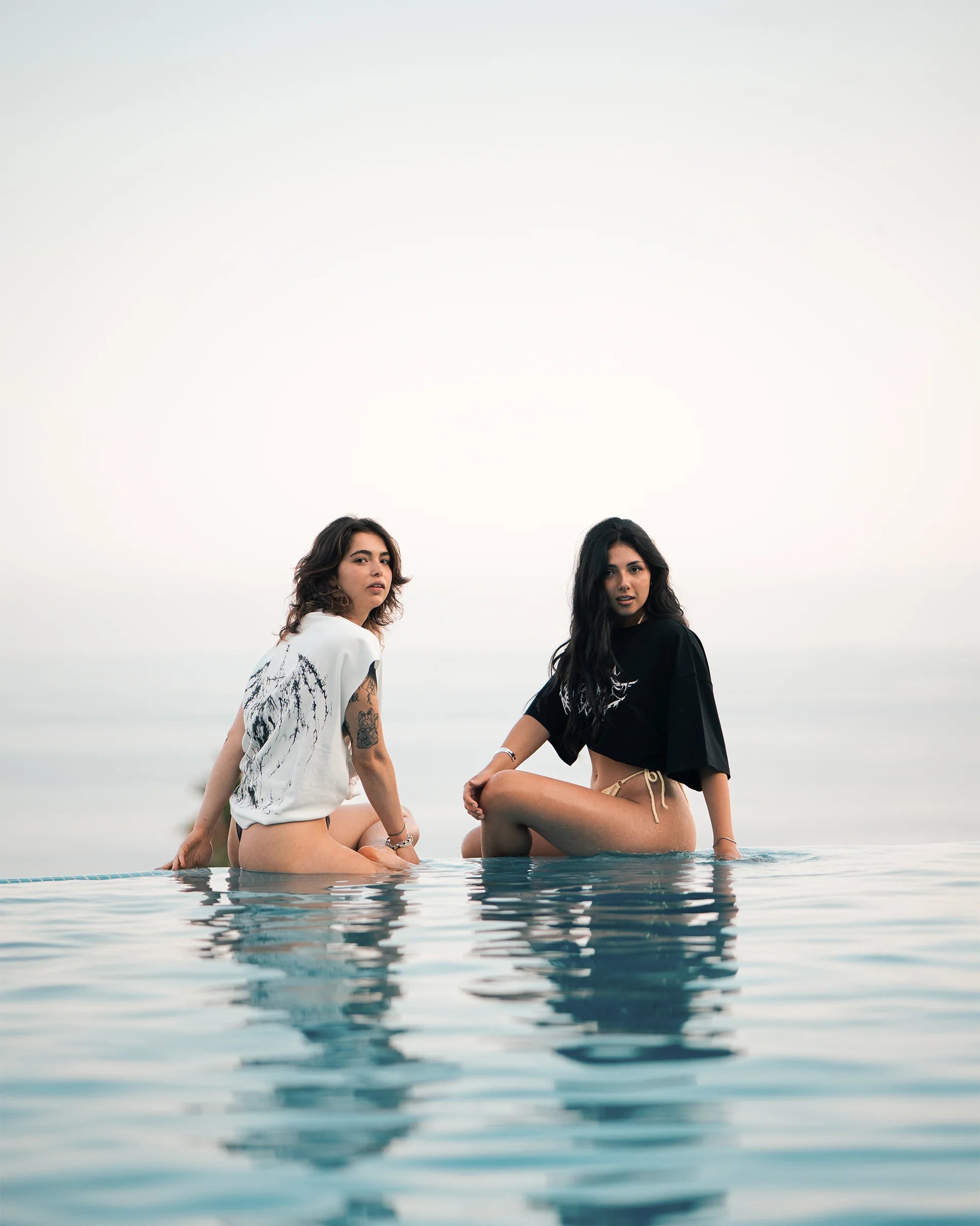 Woman wearing a black Berserk Vision Apparel gym compression shirt, designed for performance and a sleek athletic fit