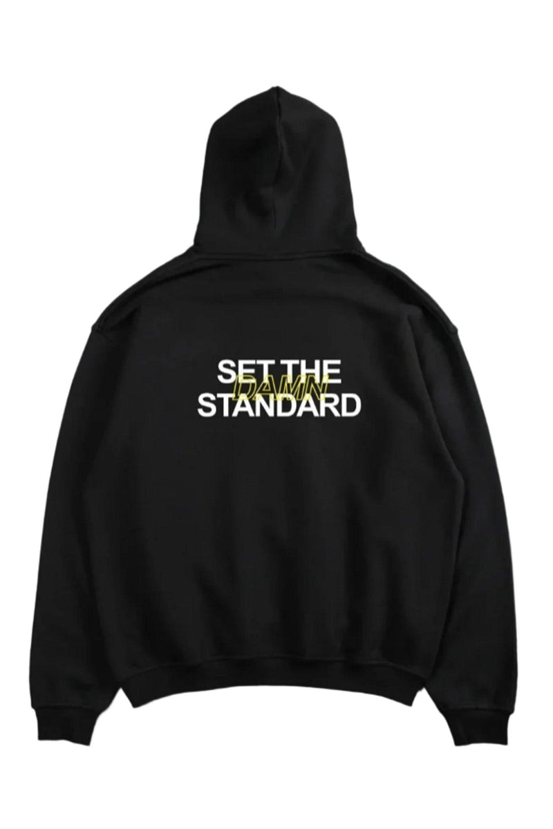 Oversized hoodie featuring 'Set the Standard' text, designed for comfort and style with a relaxed fit and adjustable drawstring hood.
