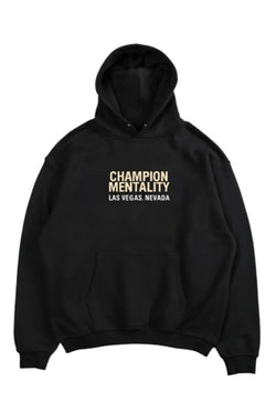 Black hoodie featuring 'Champion Mentality' on the front, designed for comfort and style.