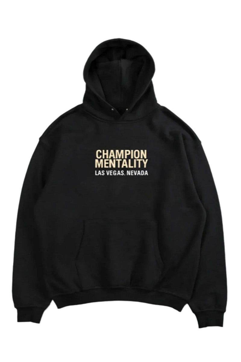 Black hoodie featuring 'Champion Mentality' on the front, designed for comfort and style.