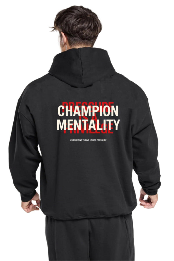 Black hoodie featuring 'Champion Mentality' on the front, designed for comfort and style.