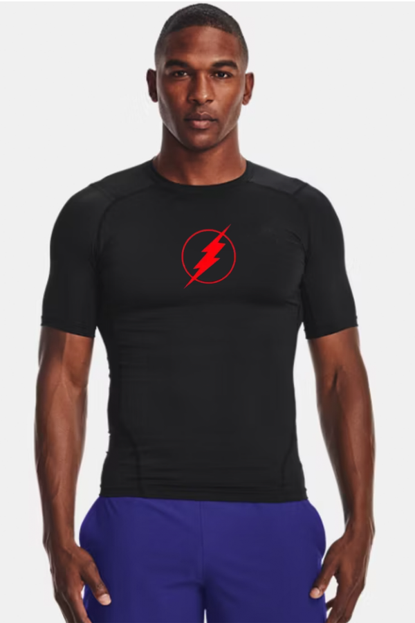 Man wearing a black athletic shirt with a red logo on a white background