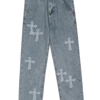 Blue jeans with white cross patterns on a white background
