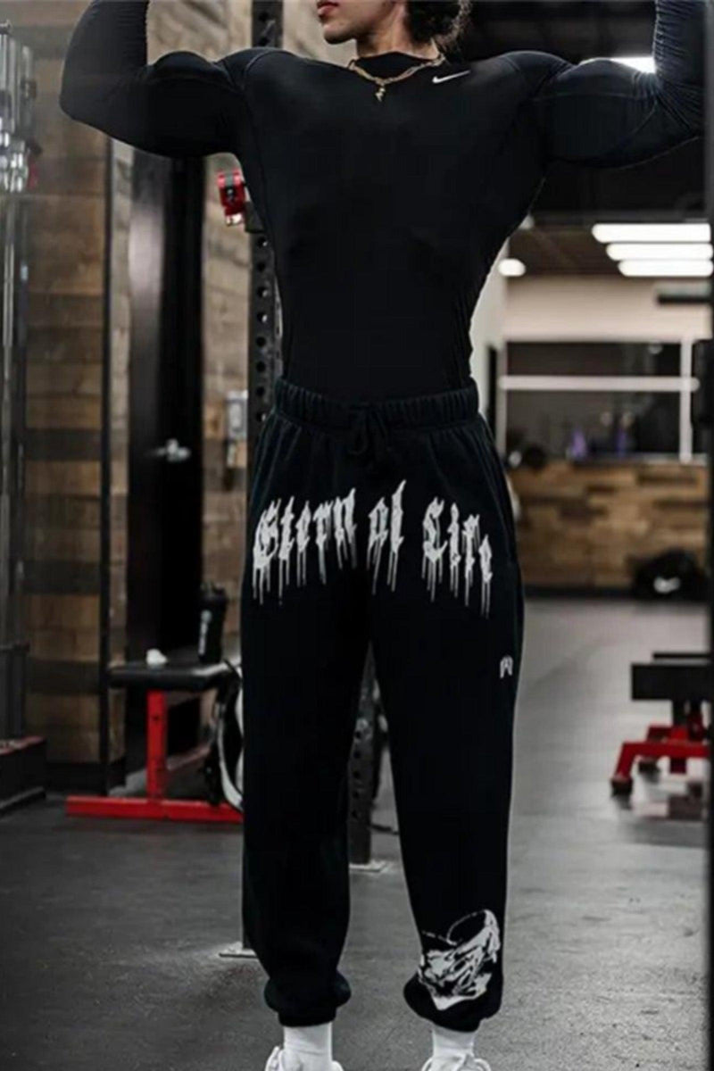 Unisex 'Eternal Life' joggers with elastic waist, side pockets, and tapered fit; 55% cotton, 45% polyester.
