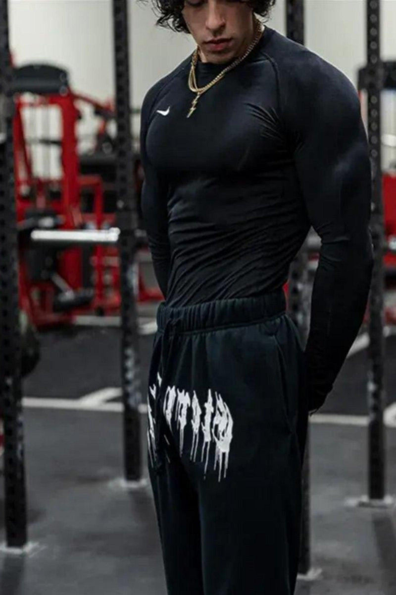 Unisex 'Eternal Life' joggers with elastic waist, side pockets, and tapered fit; 55% cotton, 45% polyester.
