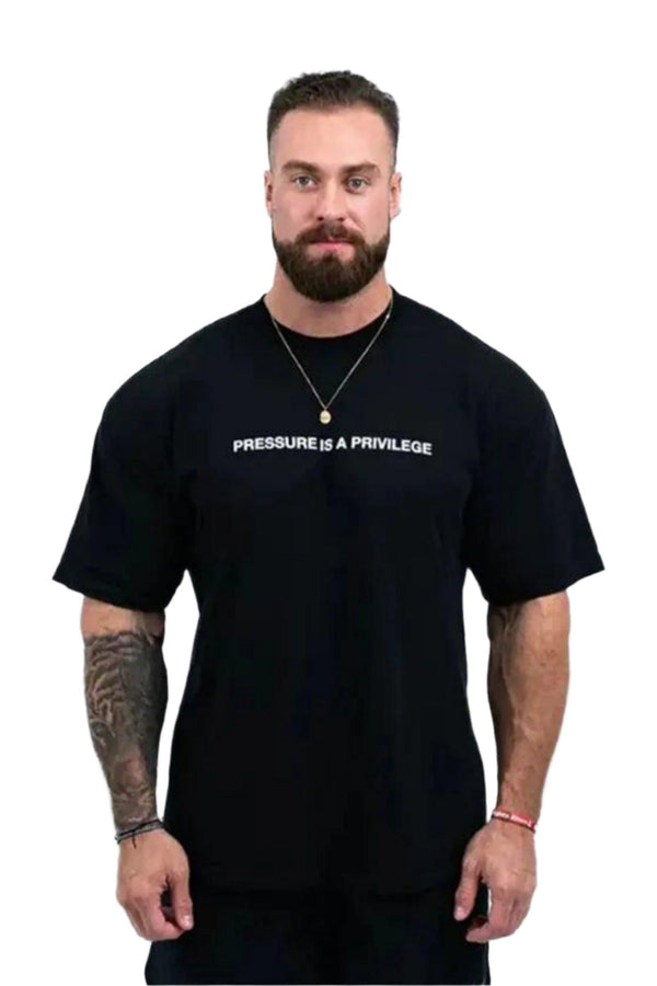 Pump cover with 'Pressure is a Privilege' text, featuring an oversized fit for comfort and style during workouts.