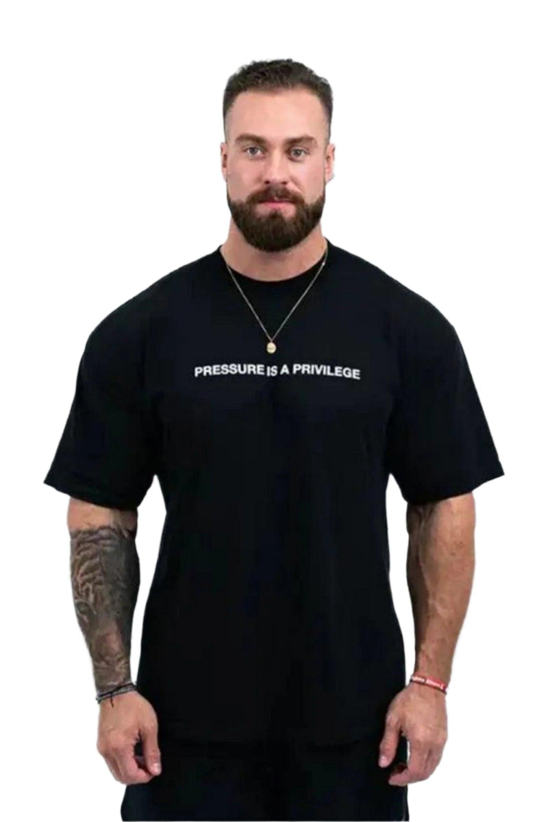 Pump cover with 'Pressure is a Privilege' text, featuring an oversized fit for comfort and style during workouts.