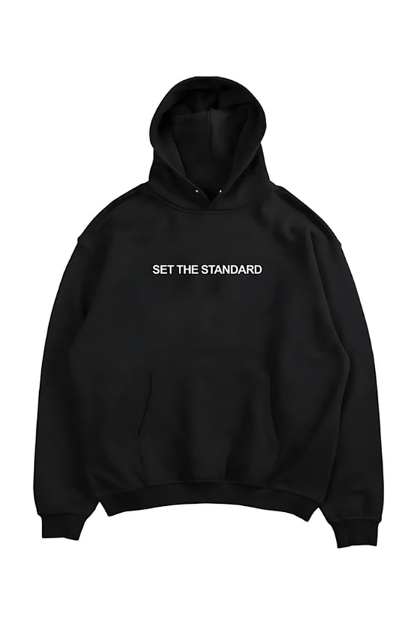 Oversized hoodie featuring 'Set the Standard' text, designed for comfort and style with a relaxed fit and adjustable drawstring hood.