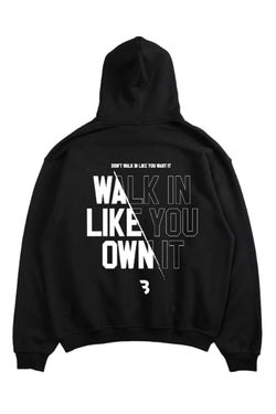 Oversized hoodie with 'Walk Like You Own It' text, designed for comfort and style with a relaxed fit and adjustable drawstring hood.