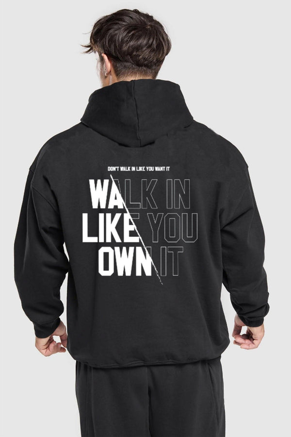 Oversized hoodie with 'Walk Like You Own It' text, designed for comfort and style with a relaxed fit and adjustable drawstring hood.